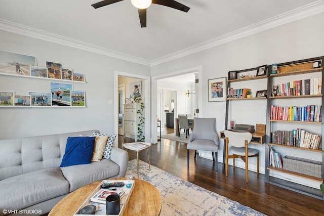 living room with dark wood-type flooring, ceiling fan, and ornamental molding