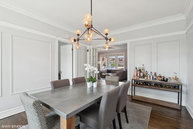 dining room featuring a notable chandelier, french doors, crown molding, and dark hardwood / wood-style floors