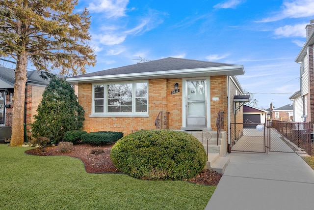 view of front facade with a garage and a front lawn