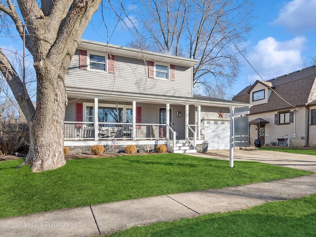 view of front facade with covered porch, a garage, and a front lawn