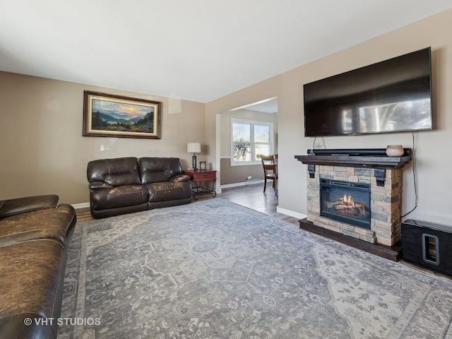 living room featuring a fireplace and hardwood / wood-style flooring