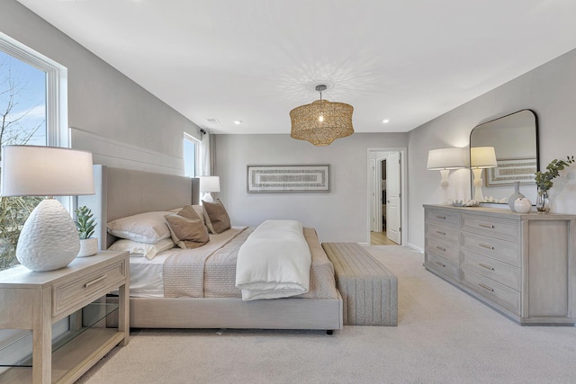 bedroom featuring light colored carpet