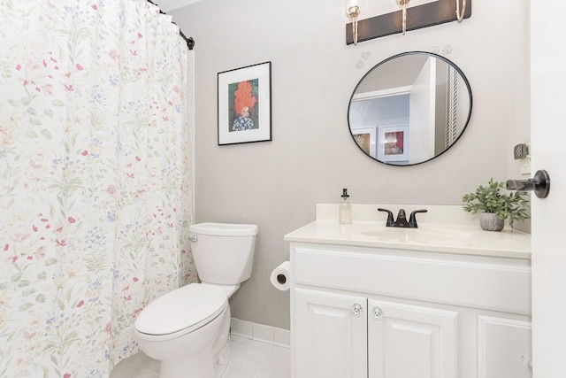 bathroom featuring tile patterned flooring, vanity, and toilet