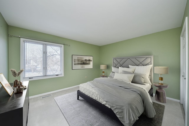 bedroom featuring visible vents, baseboards, and carpet floors