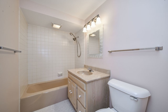 bathroom featuring tile patterned flooring, tub / shower combination, toilet, and vanity