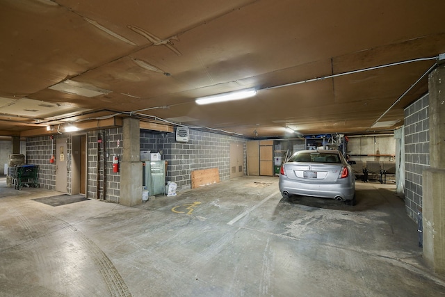 garage with concrete block wall