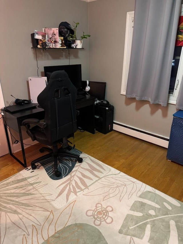 office area featuring light hardwood / wood-style floors and baseboard heating