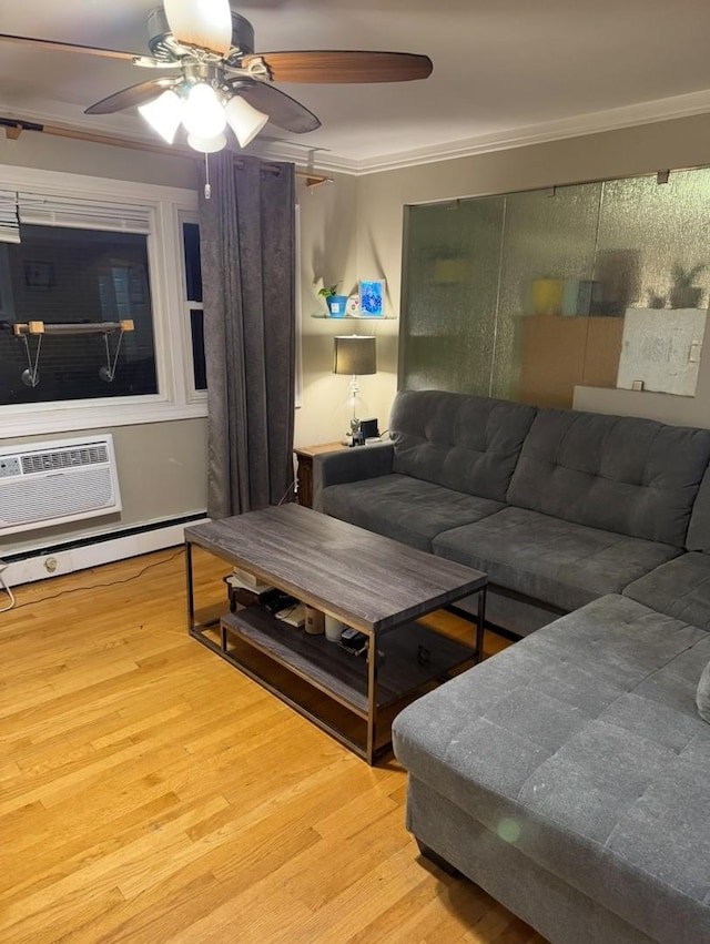 living room with light hardwood / wood-style floors, ceiling fan, ornamental molding, and an AC wall unit