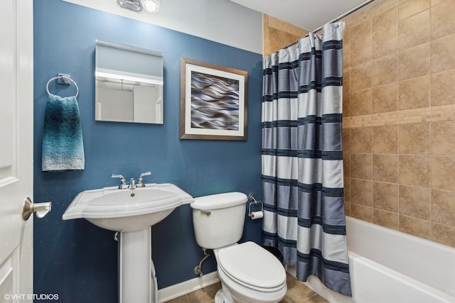 bathroom featuring toilet and shower / tub combo with curtain