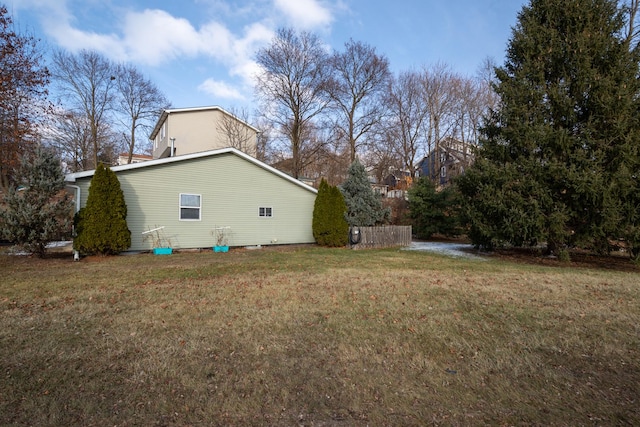 view of home's exterior with a lawn