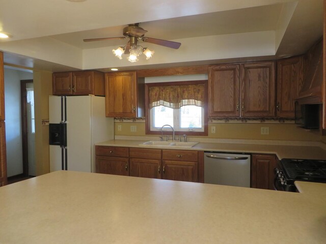 unfurnished living room with hardwood / wood-style flooring, sink, and ceiling fan