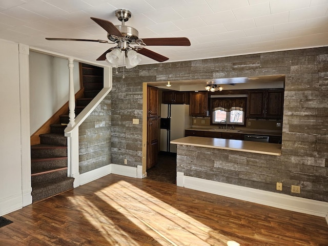 kitchen with dark hardwood / wood-style floors, sink, dishwashing machine, dark brown cabinets, and white fridge with ice dispenser