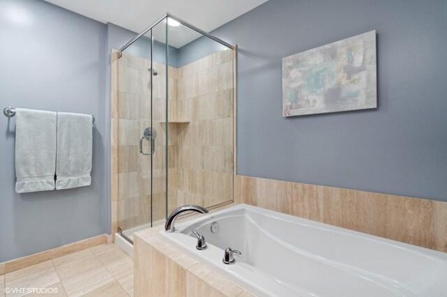 bathroom featuring shower with separate bathtub and tile patterned floors