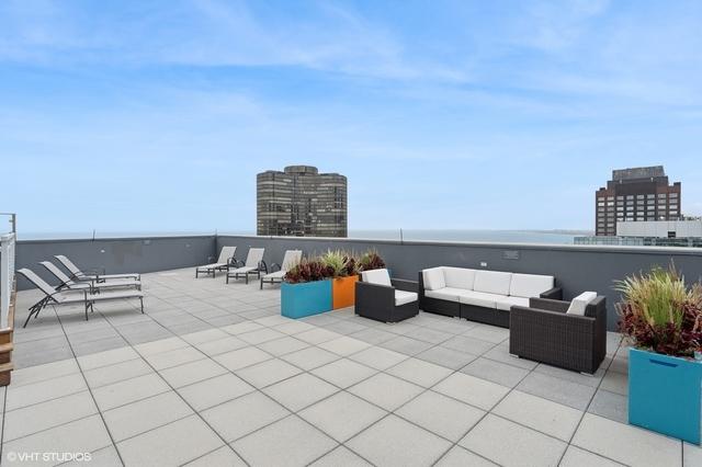 view of patio with an outdoor hangout area and a water view