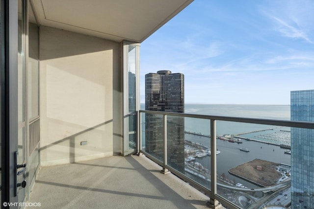 balcony featuring a water view