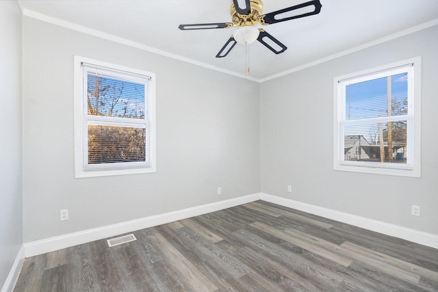 unfurnished room featuring ornamental molding, ceiling fan, and dark wood-type flooring