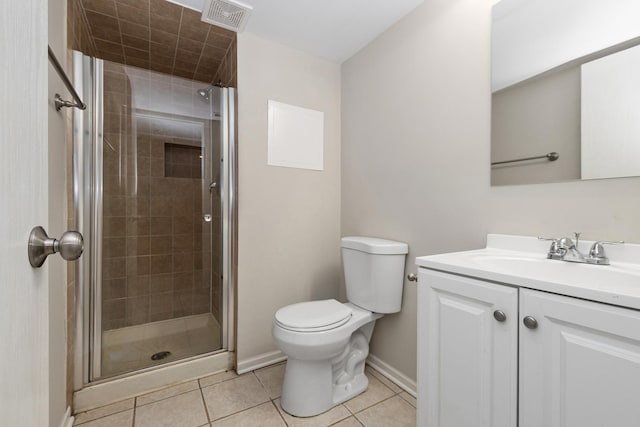 bathroom featuring toilet, an enclosed shower, tile patterned flooring, and vanity