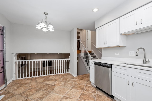 kitchen featuring sink, decorative light fixtures, white cabinets, stainless steel dishwasher, and a notable chandelier