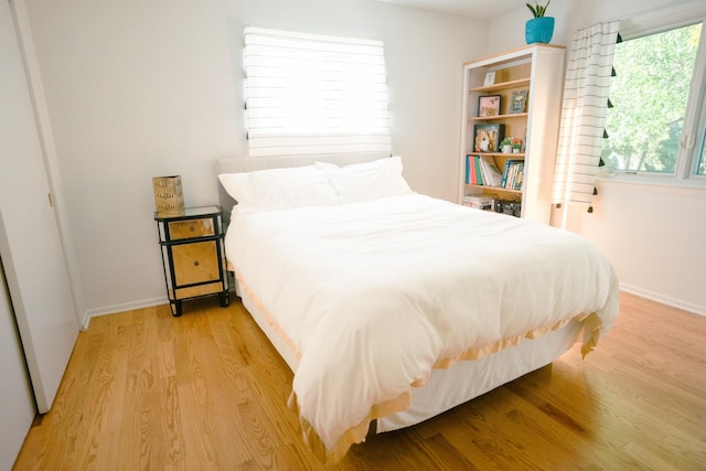 bedroom with light hardwood / wood-style flooring