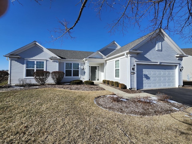 single story home with a garage and a front yard