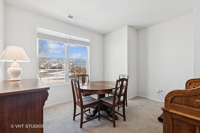 view of carpeted dining area