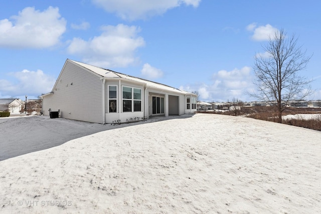 view of snow covered house