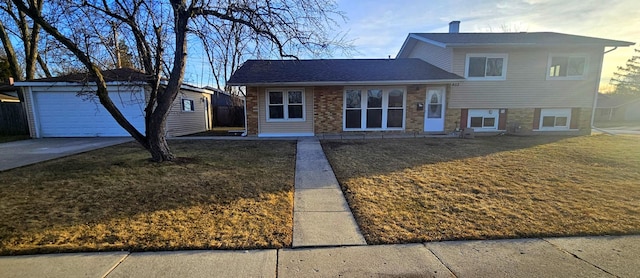 tri-level home with a front lawn