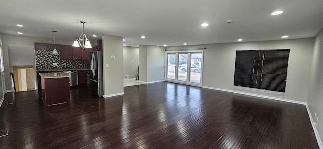 unfurnished living room featuring dark wood-type flooring