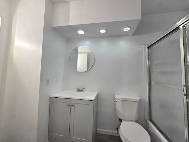 full bathroom with vanity, combined bath / shower with glass door, and toilet