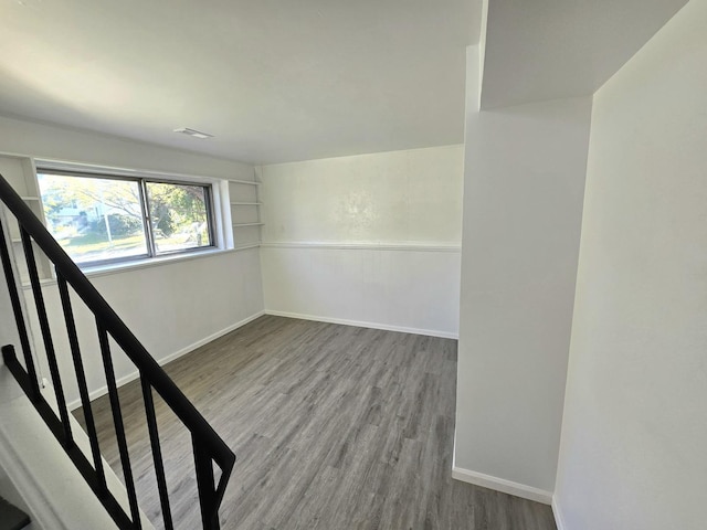 basement featuring hardwood / wood-style floors