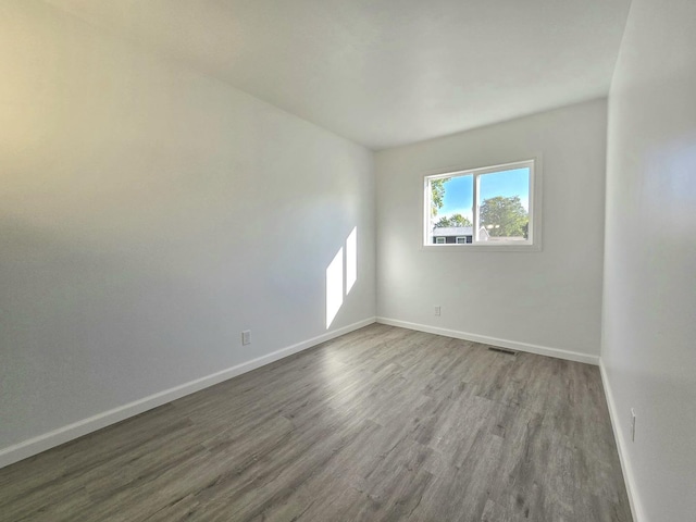 unfurnished room featuring wood-type flooring