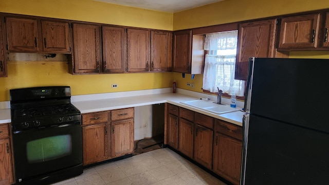 kitchen with black appliances and sink