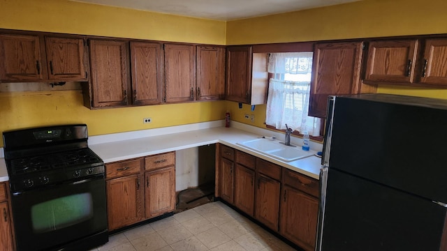 kitchen with black appliances and sink