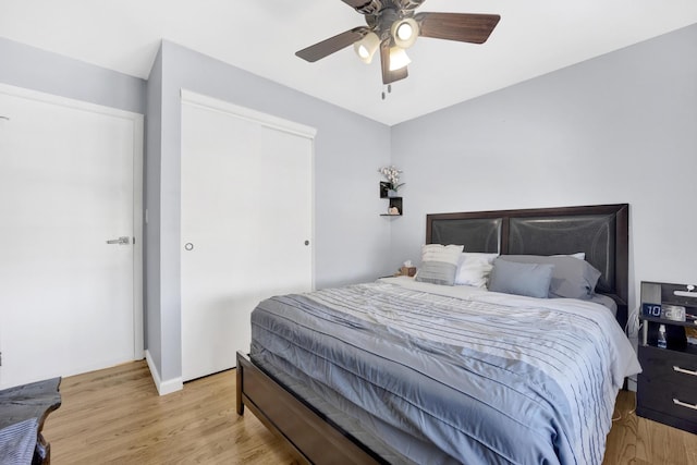 bedroom featuring light wood-type flooring and ceiling fan