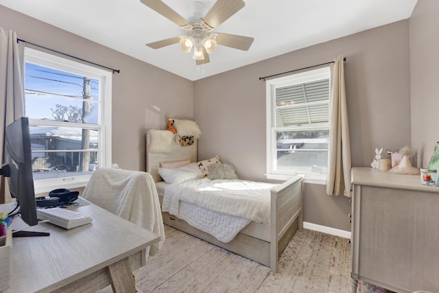 bedroom featuring light wood-type flooring and ceiling fan