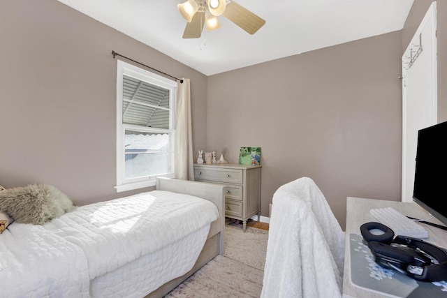 bedroom featuring light wood-type flooring and ceiling fan