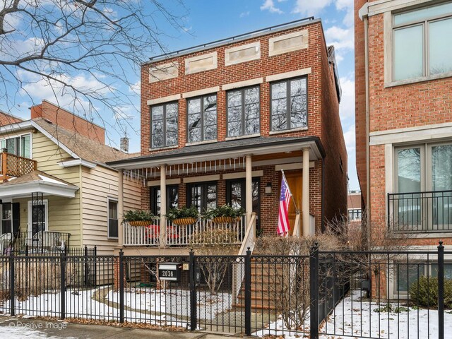 view of property featuring covered porch