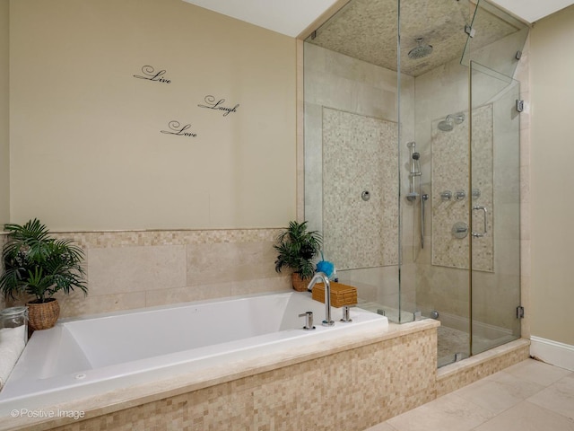 bathroom with tile patterned floors and separate shower and tub