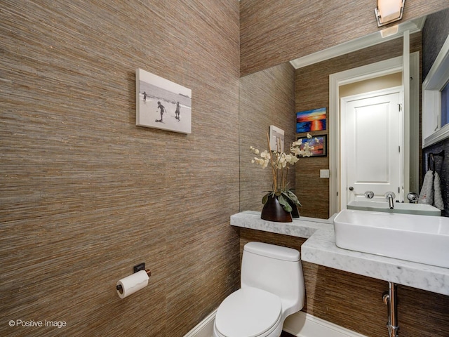 bathroom featuring sink and toilet