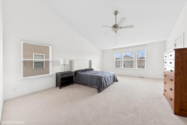 bedroom with ceiling fan, light carpet, and high vaulted ceiling