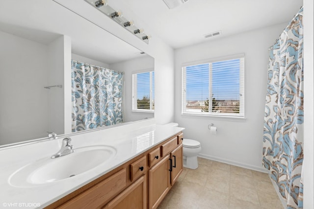 bathroom with toilet and vanity