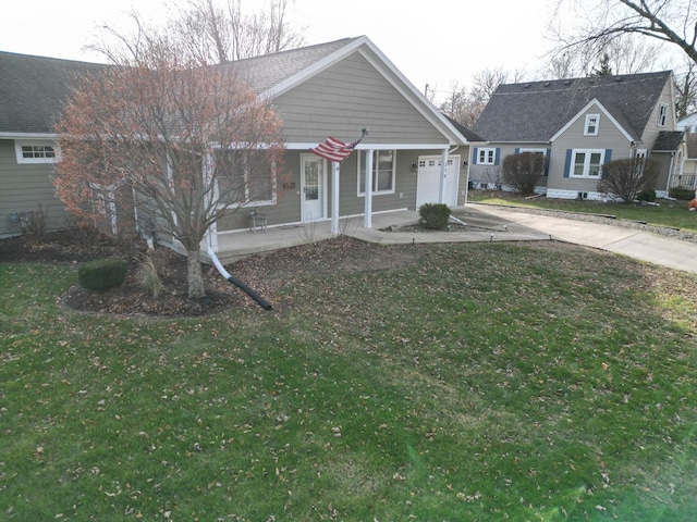 view of front facade with a garage, a porch, and a front lawn