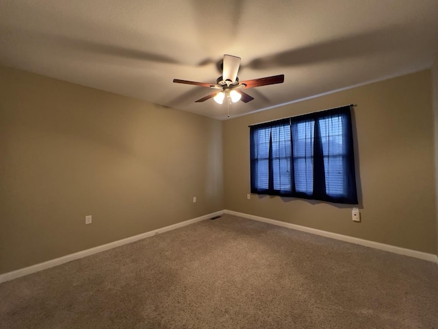 unfurnished room featuring carpet floors and ceiling fan