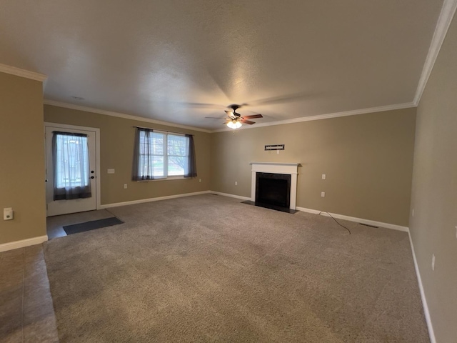 unfurnished living room with carpet flooring, ceiling fan, and crown molding