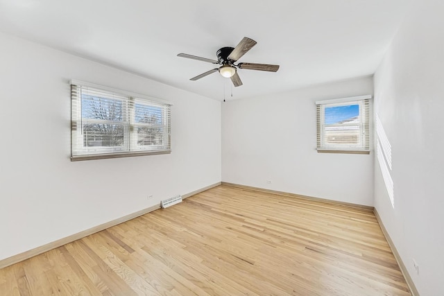 empty room with light hardwood / wood-style floors and ceiling fan