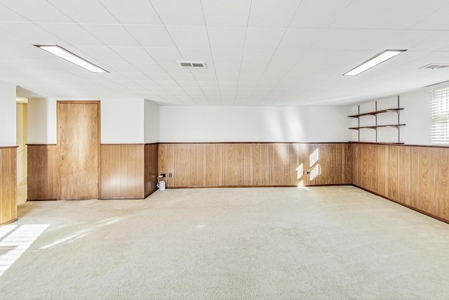 unfurnished room with light carpet