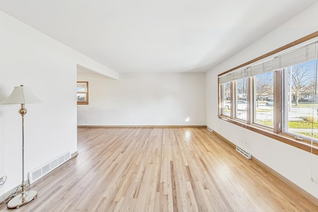 empty room with light wood-type flooring