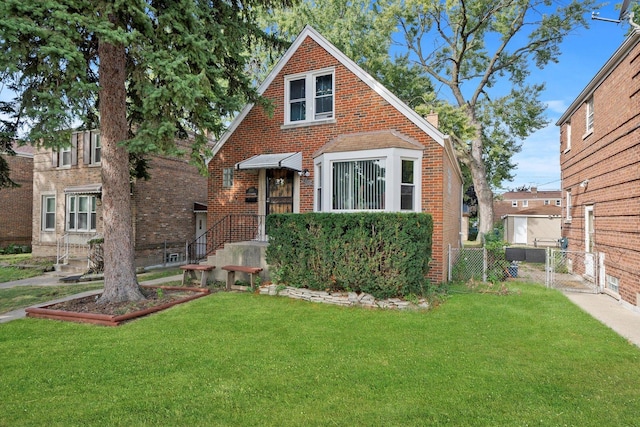 tudor-style house with a front yard