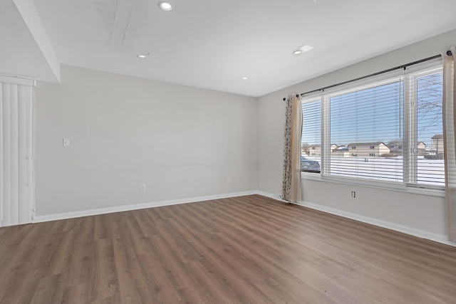 empty room featuring hardwood / wood-style flooring