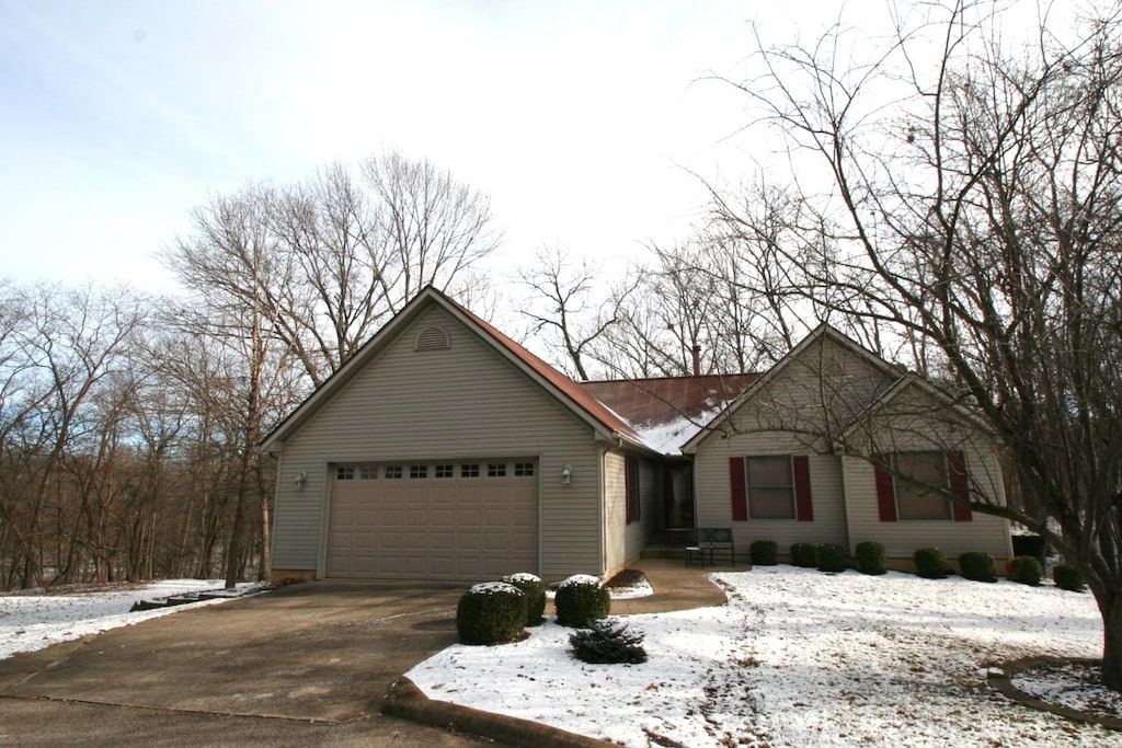 ranch-style house featuring a garage